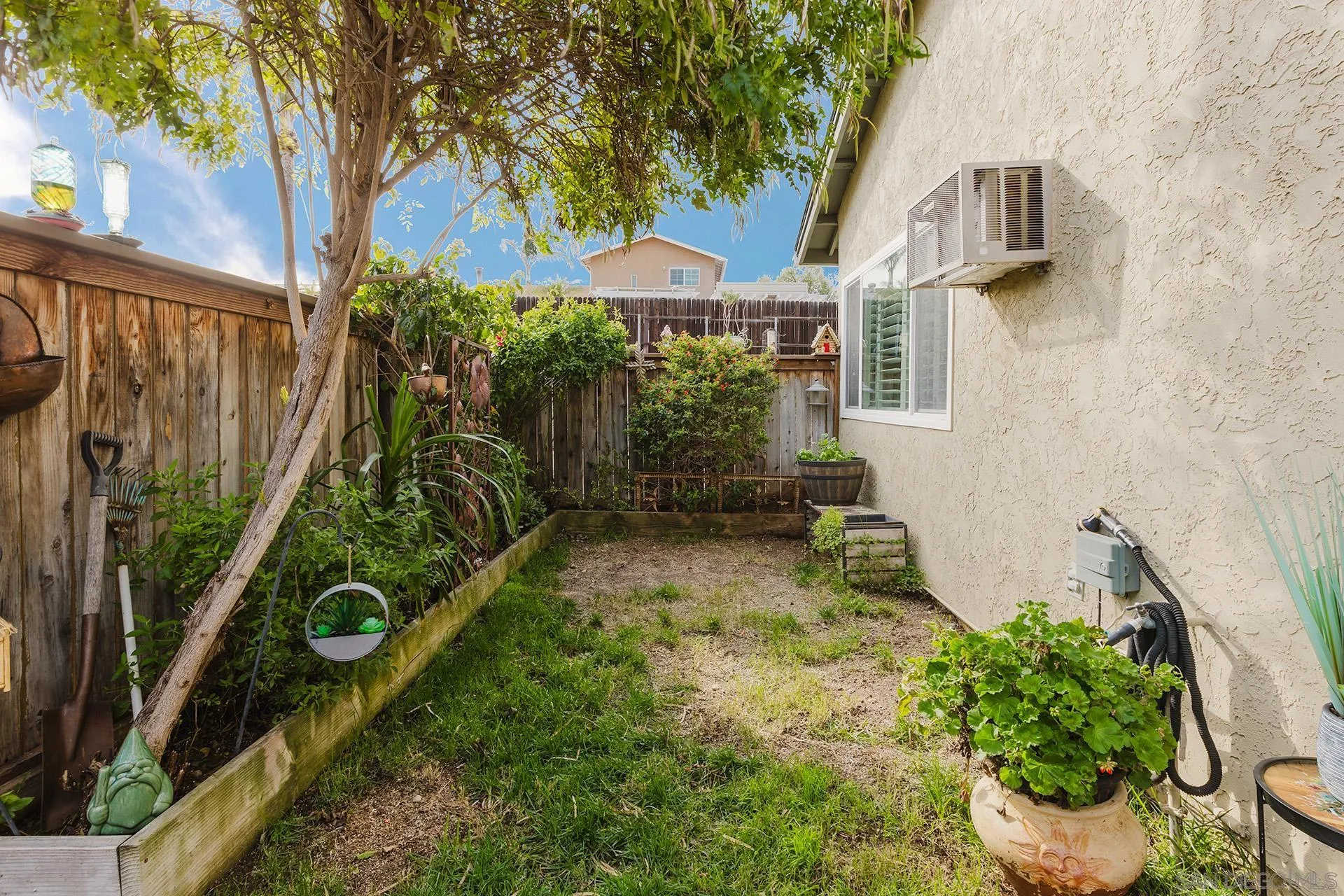 10214 Michala Place Santee, CA 92071 - Photo 19 of 25 a backyard of a house with lots of green space