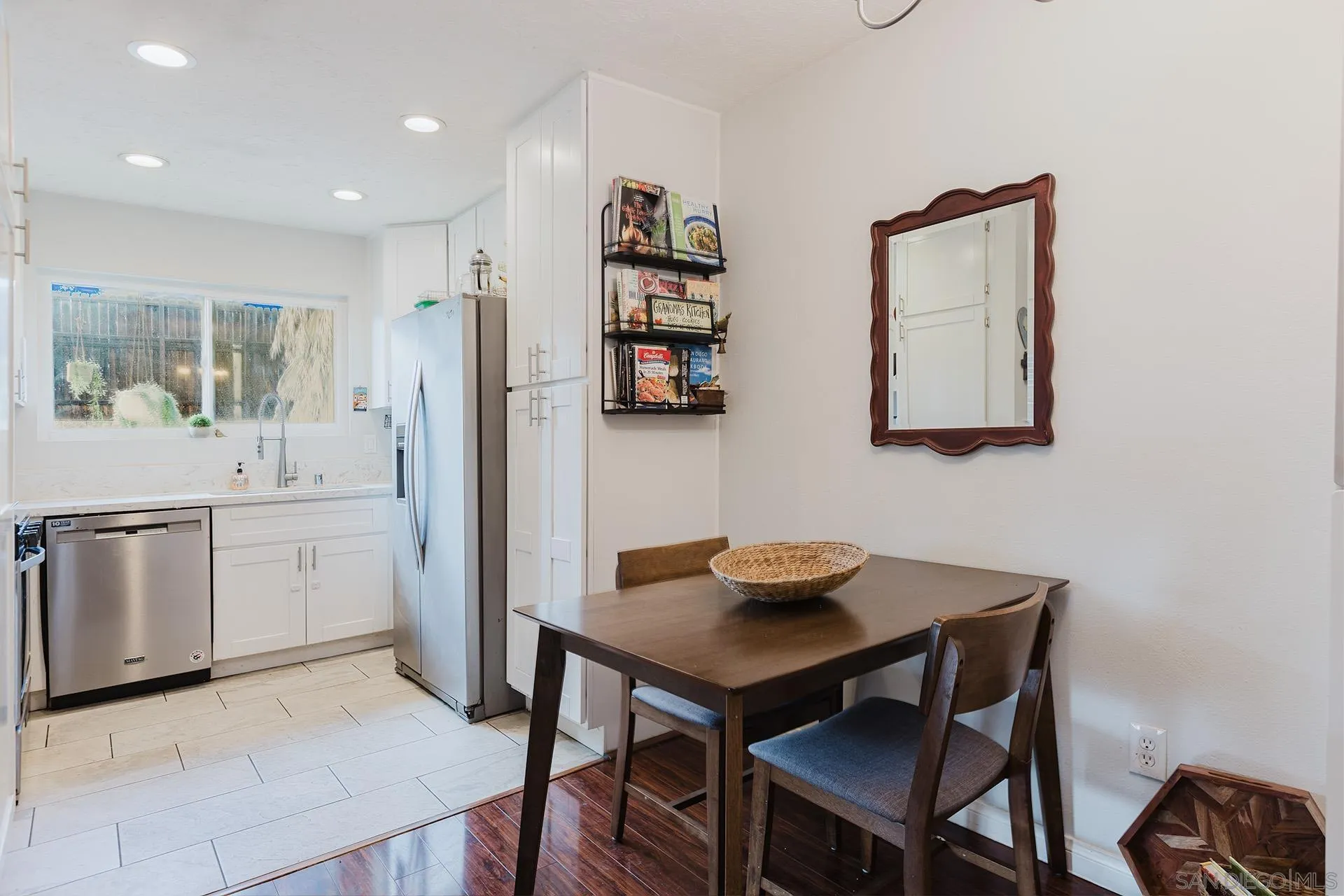 10214 Michala Place Santee, CA 92071 - Photo 9 of 25 a kitchen with a table chairs and a refrigerator