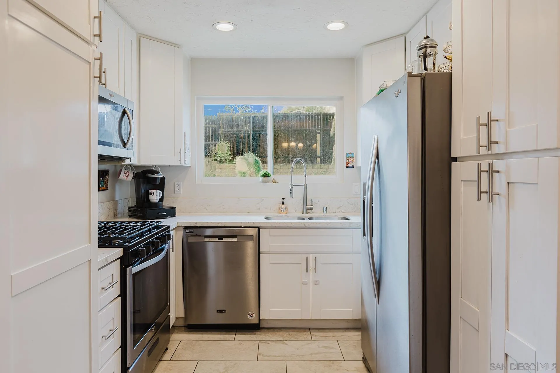 10214 Michala Place Santee, CA 92071 - Photo 10 of 25 a kitchen with stainless steel appliances granite countertop a refrigerator and a sink