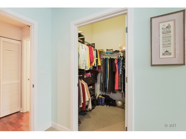 901 West Madison Street, Unit 905 Chicago, IL 60607 - Photo 8 of 10 a view of walk in closet with clothes
