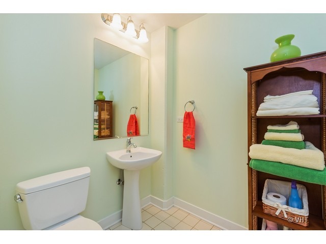 901 West Madison Street, Unit 905 Chicago, IL 60607 - Photo 9 of 10 a bathroom with a sink and a toilet