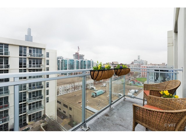 901 West Madison Street, Unit 905 Chicago, IL 60607 - Photo 10 of 10 a terrace with outdoor seating and city view