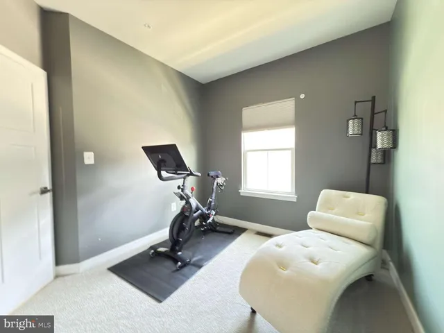 a room with table closet and windows