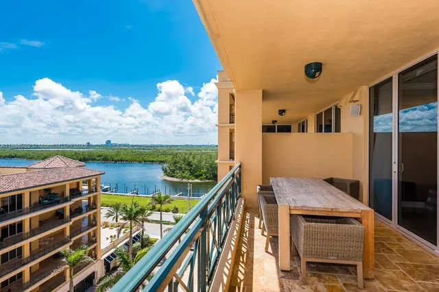 a view of balcony with two chairs and a table