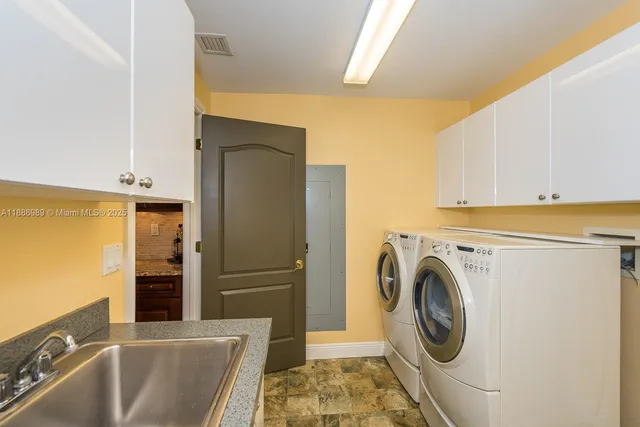 a view of a kitchen with washer and dryer