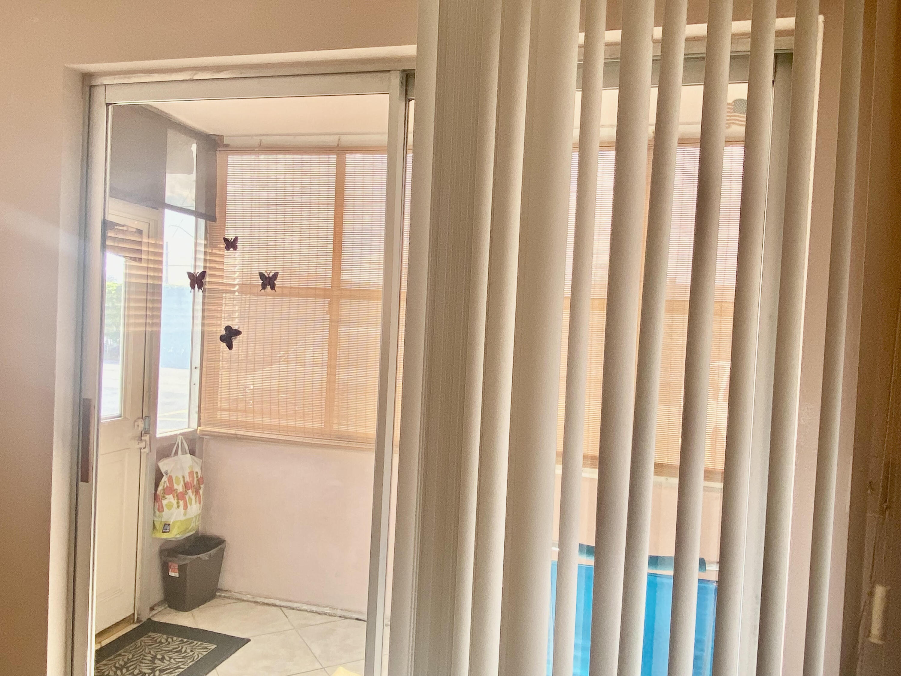 64 Flanders B, Unit 64 Delray Beach, FL 33484 - Photo 11 of 35 a bathroom with a glass door shower