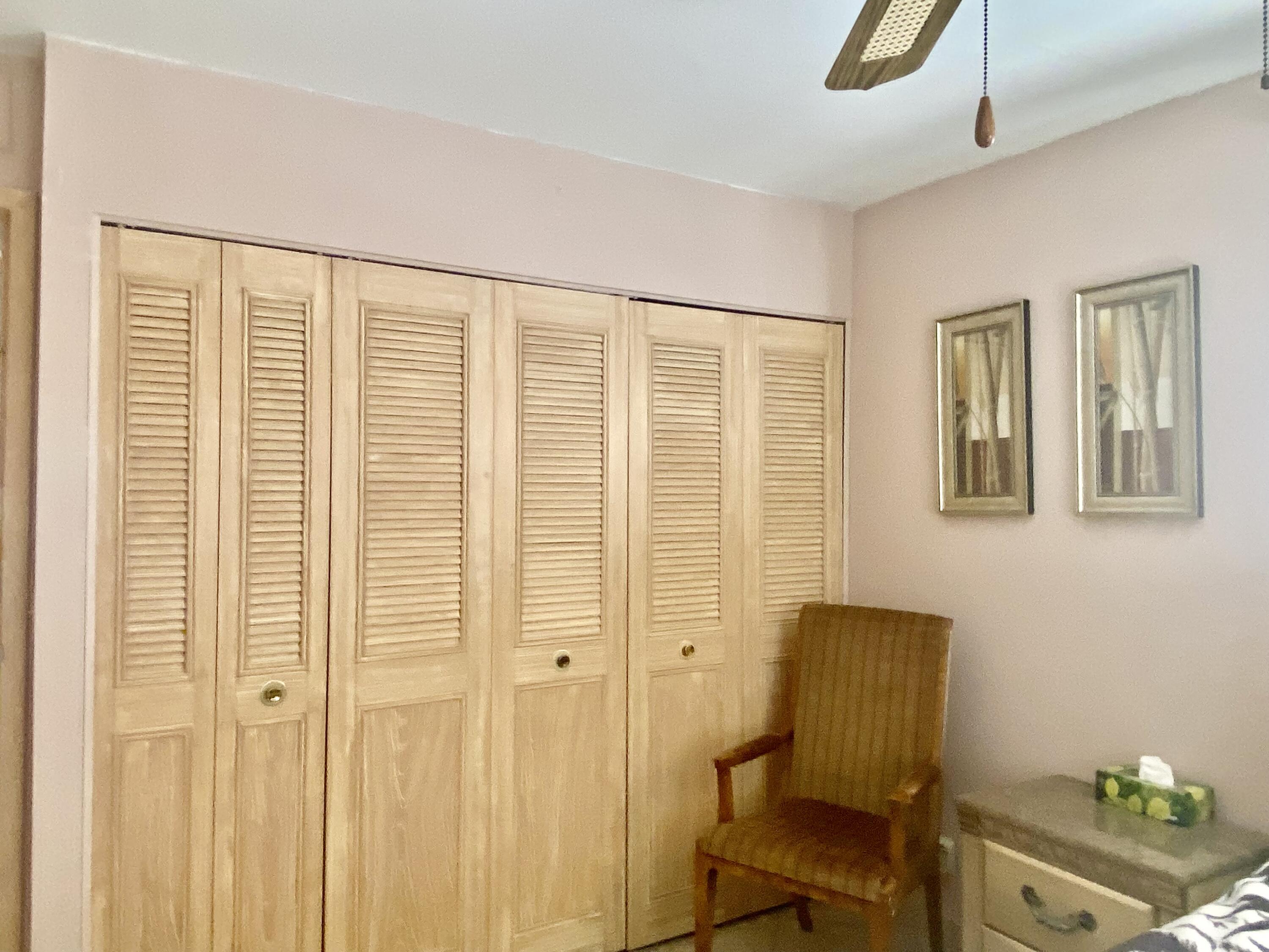 64 Flanders B, Unit 64 Delray Beach, FL 33484 - Photo 14 of 35 a view of a workspace with furniture and a window