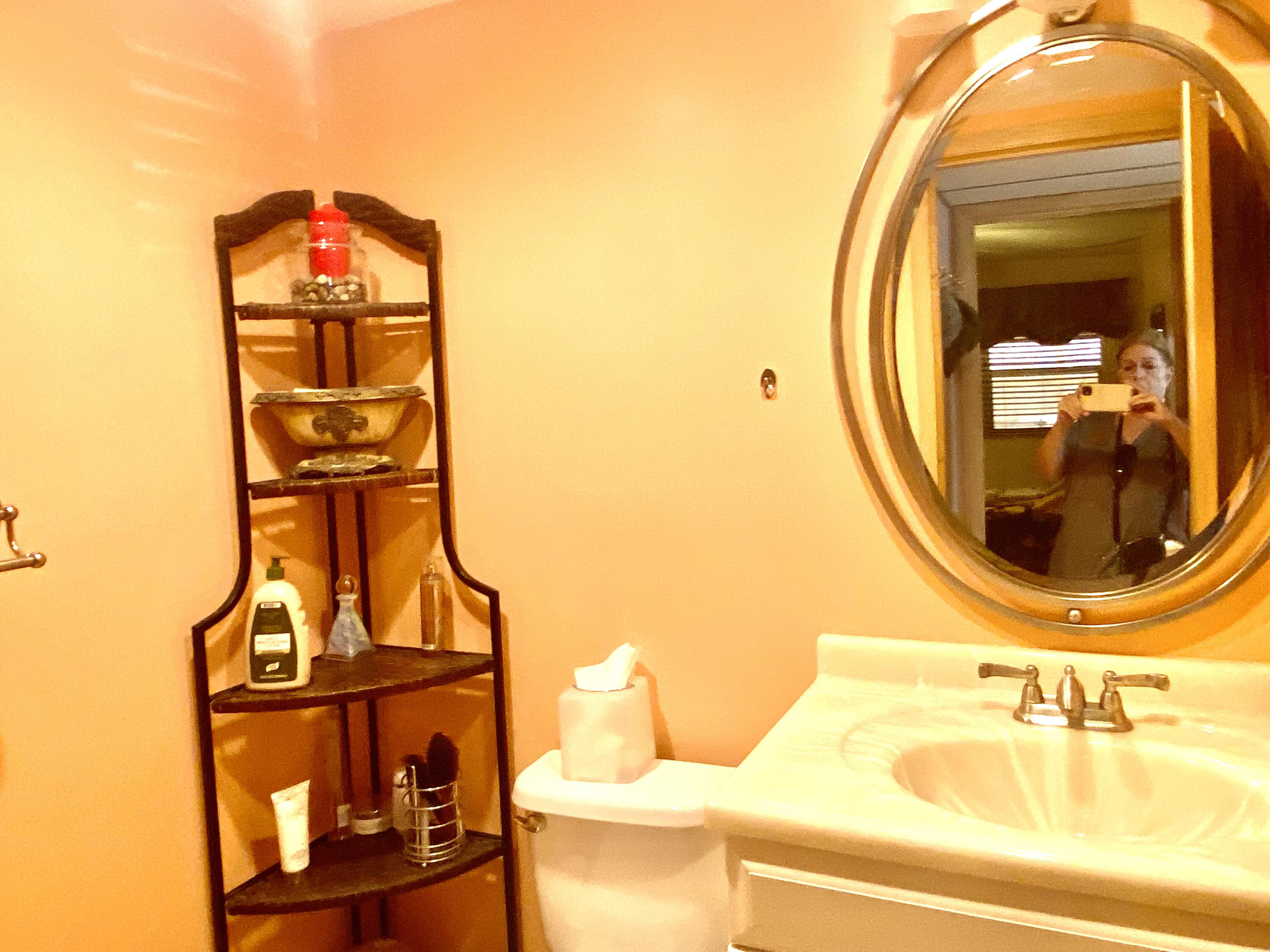 64 Flanders B, Unit 64 Delray Beach, FL 33484 - Photo 17 of 35 a bathroom with a sink and a mirror