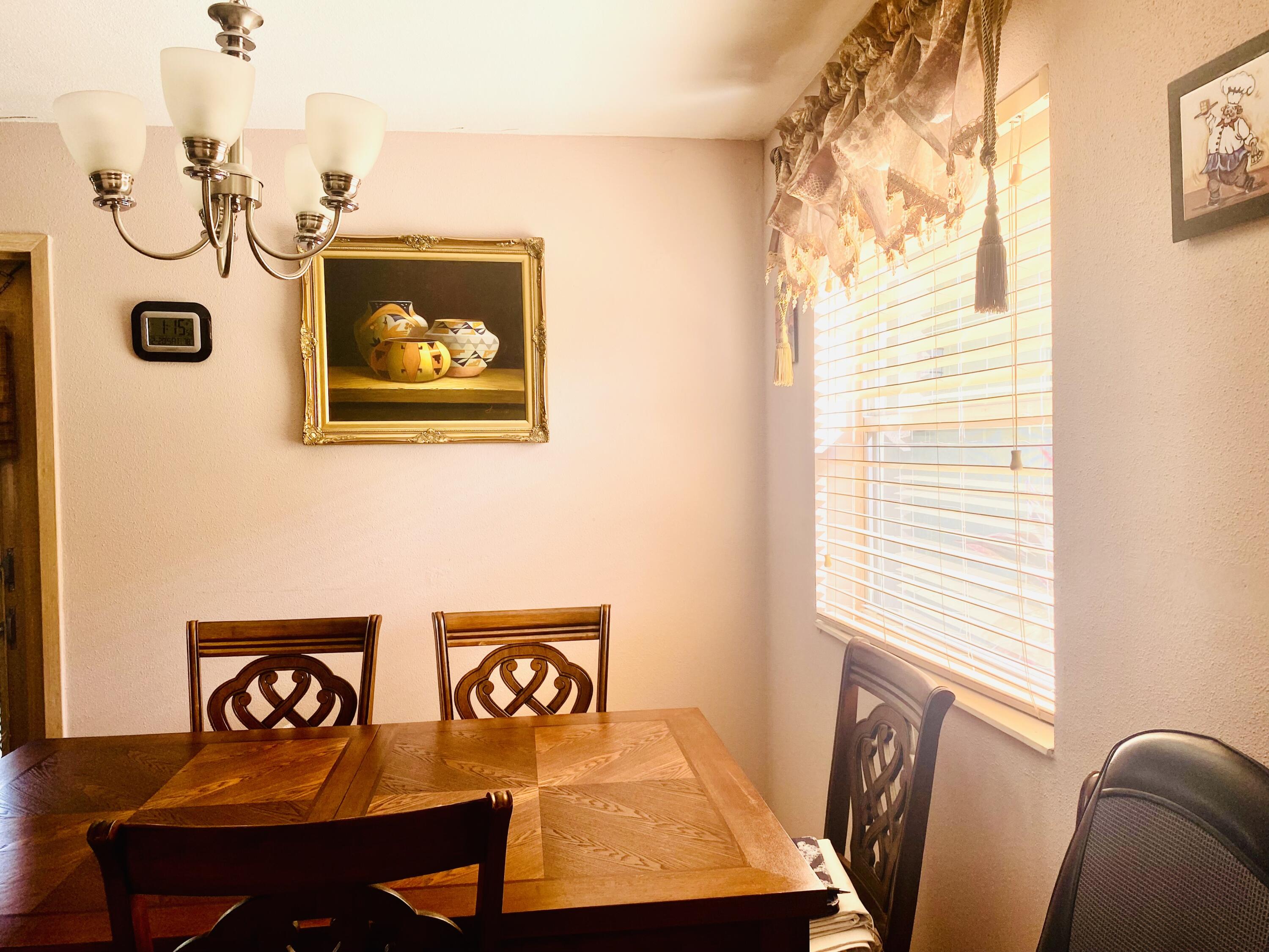 64 Flanders B, Unit 64 Delray Beach, FL 33484 - Photo 5 of 35 a view of a livingroom with furniture and window