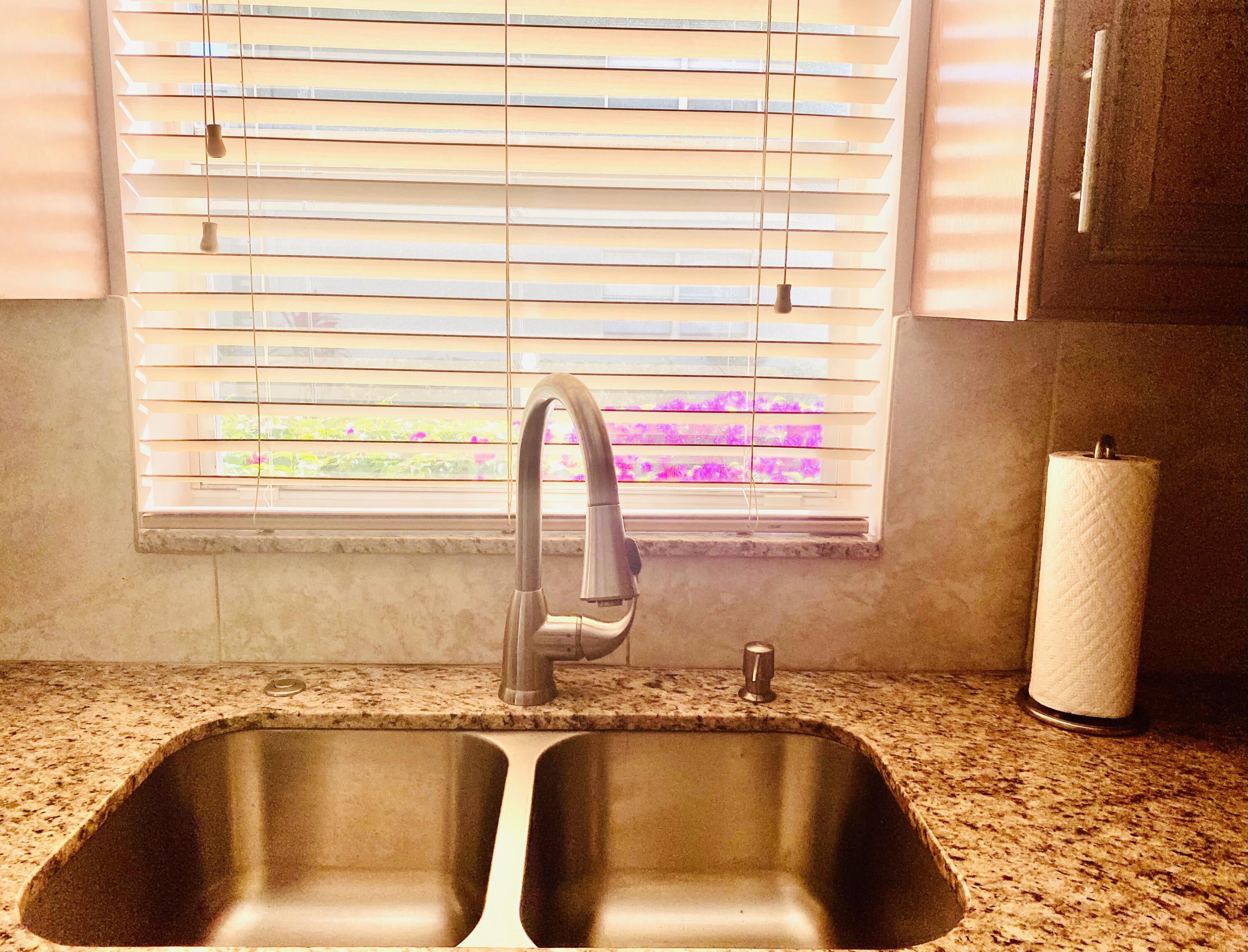 64 Flanders B, Unit 64 Delray Beach, FL 33484 - Photo 8 of 35 a bathroom with a sink and a bathtub