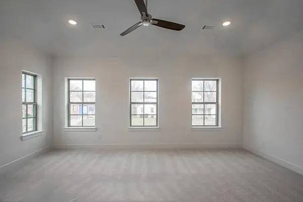 a view of an empty room with a window