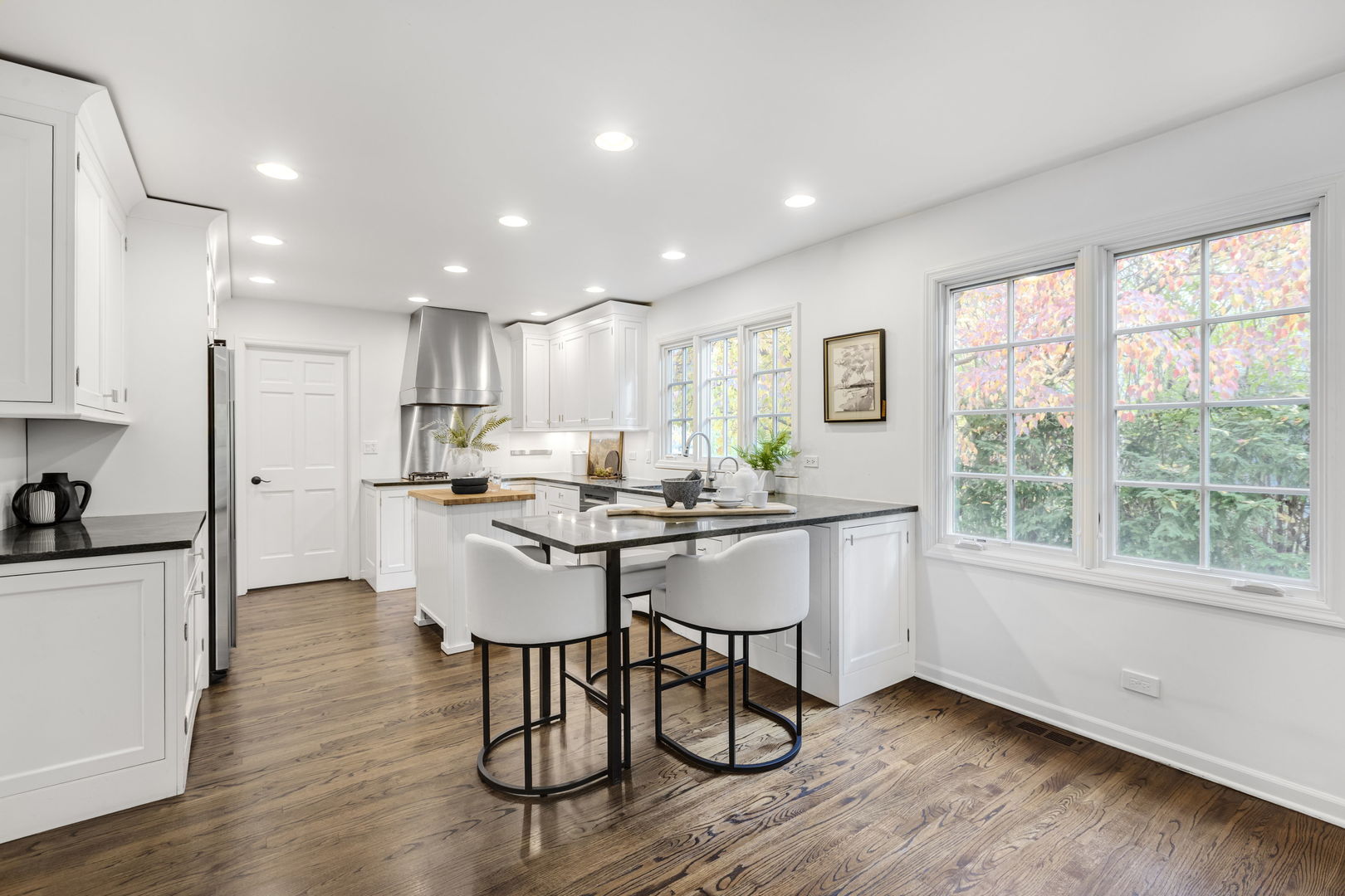 540 Buena Road Lake Forest, IL 60045 - Photo 8 of 35 a kitchen with a table chairs refrigerator and cabinets
