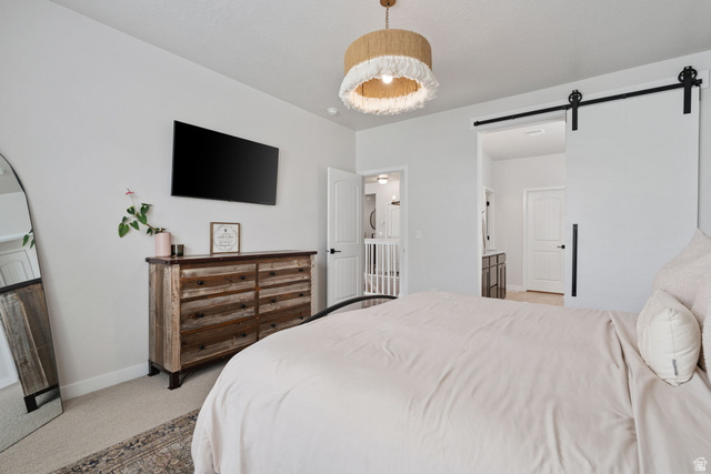1002 South Yarrow Drive Mapleton, UT 84664 - Photo 15 of 39 Spacious room with a barn door entrance, recessed lighting, and a modern ceiling fixture