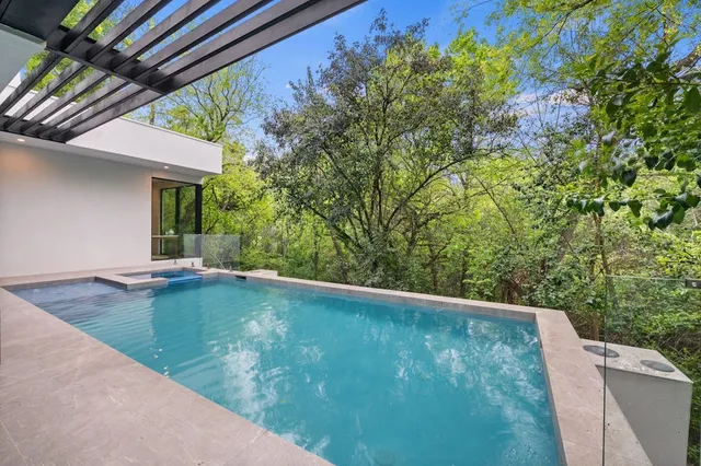 a view of a backyard with potted plants
