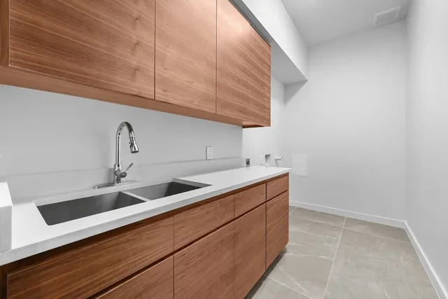 a kitchen with a sink and cabinets
