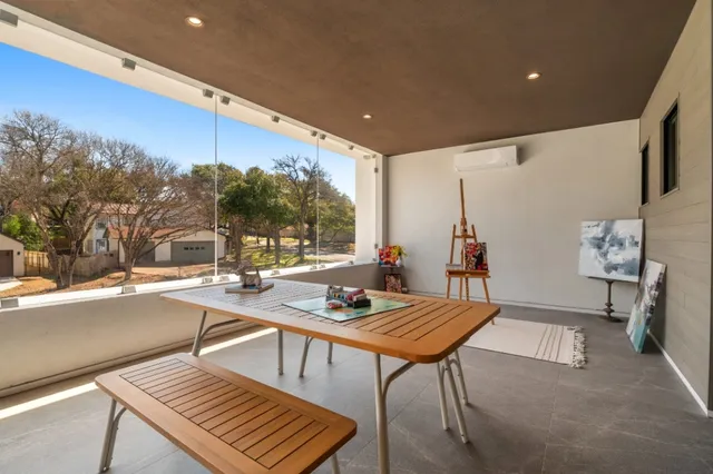 a outdoor dining space with furniture and a potted plant