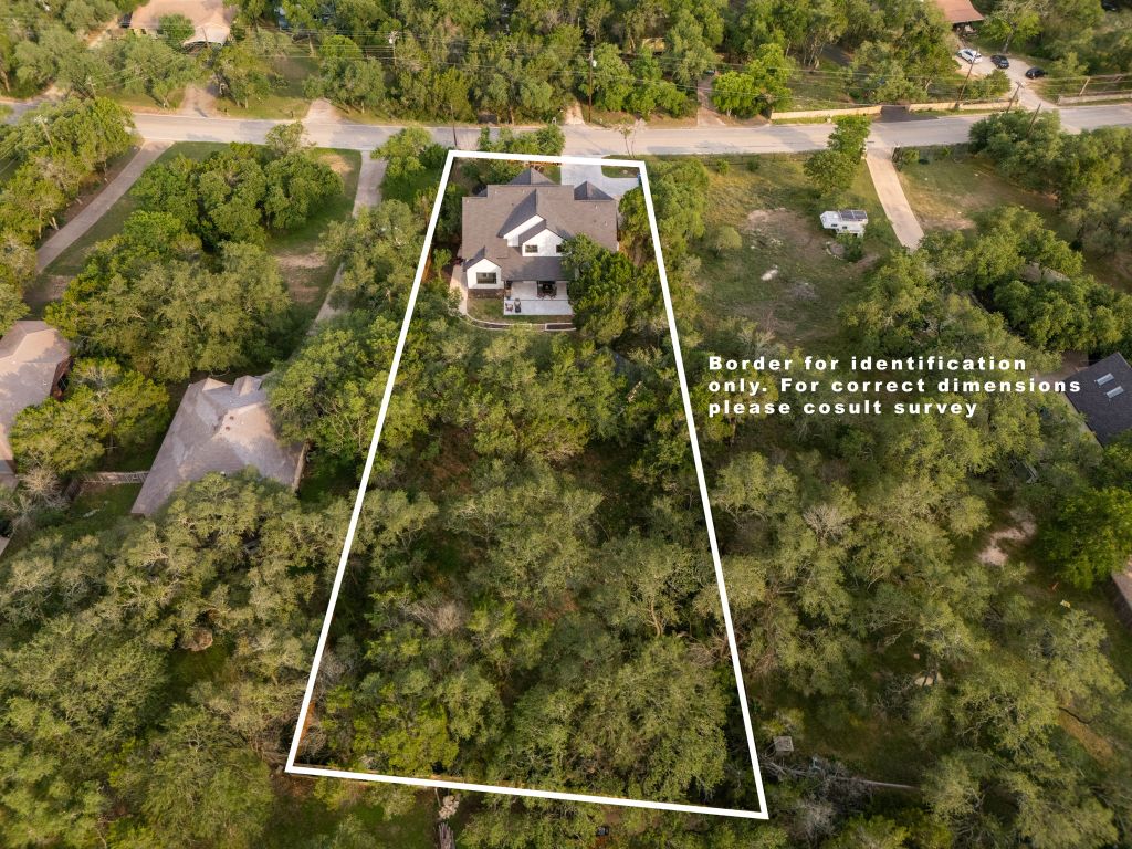 5904 Hudson Bend Road Austin, TX 78734 - Photo 2 of 37 Tucked behind a private gate and nestled beneath mature oaks, this stunning home + casita sits on an expansive .67-acre lot just steps from Lake Travis.