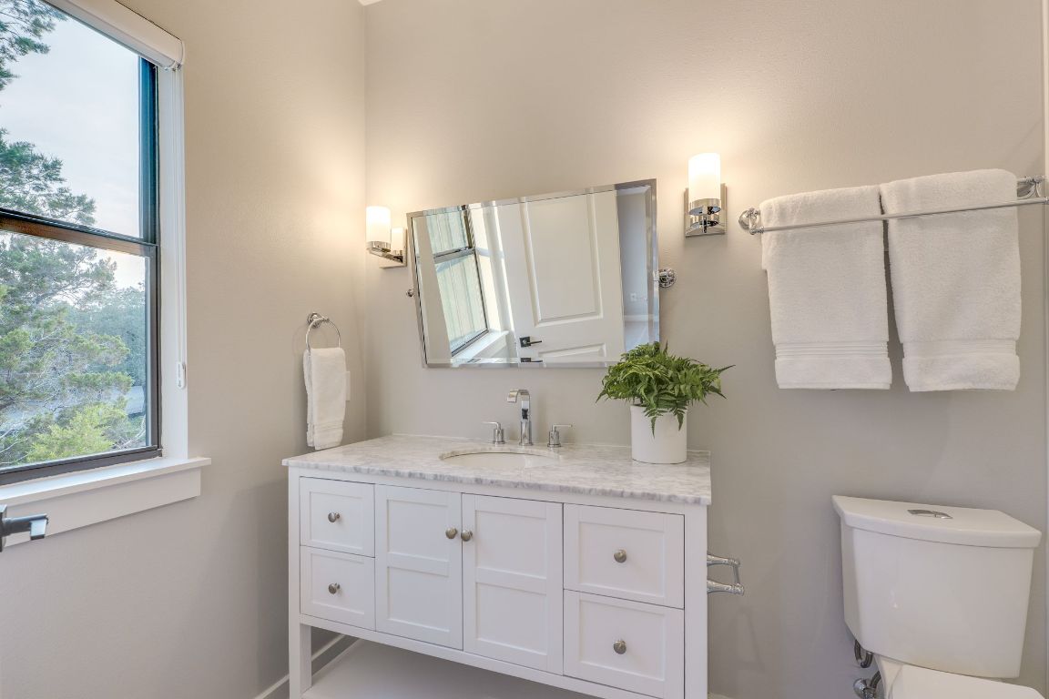 5904 Hudson Bend Road Austin, TX 78734 - Photo 28 of 37 The room's ensuite bathroom includes a quartz vanity and a shower/tub combination.