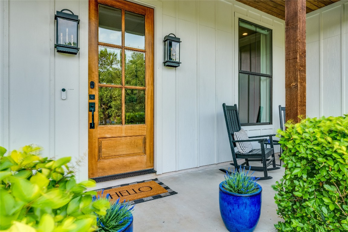 5904 Hudson Bend Road Austin, TX 78734 - Photo 9 of 37 Entrance to property featuring covered porch and board and batten siding