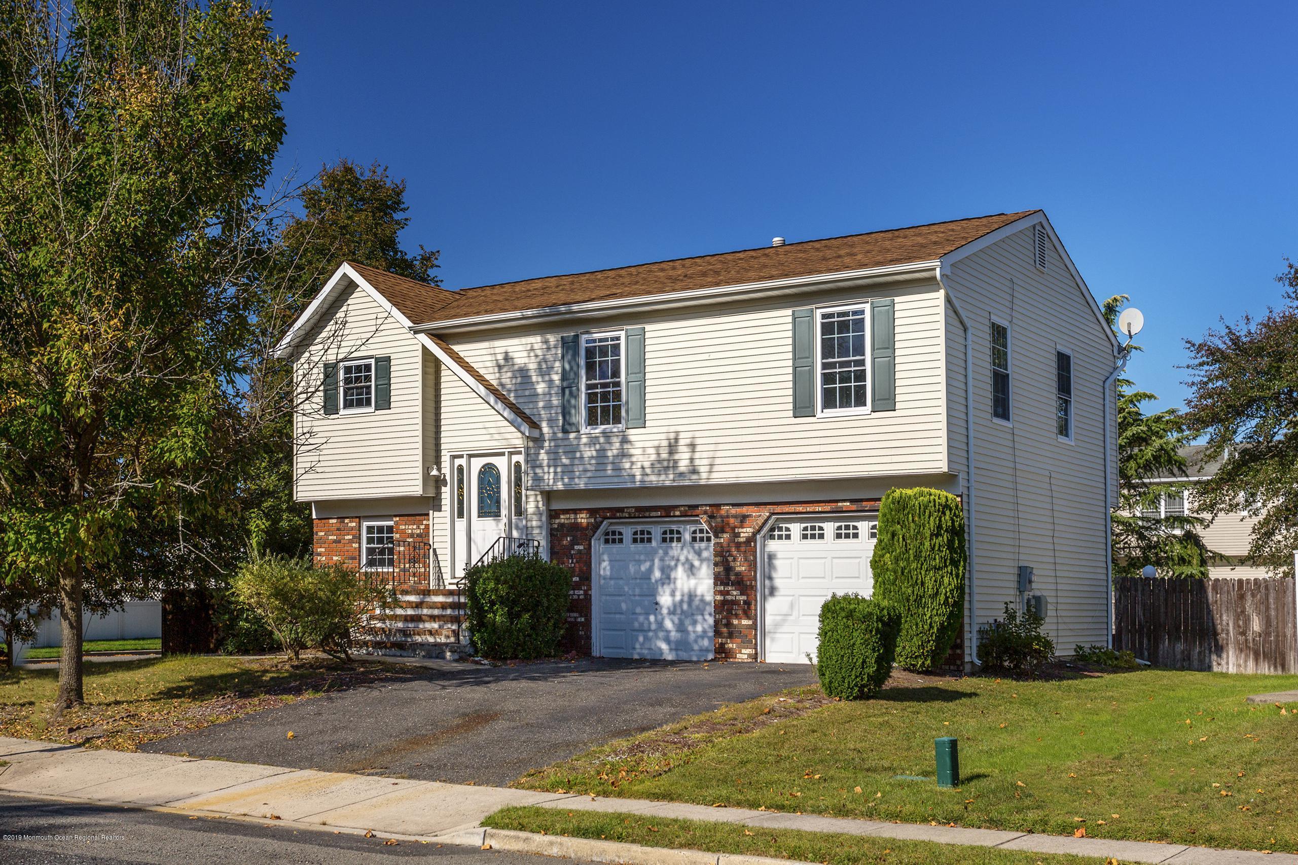32 Hedgewood Road Howell, NJ 07731 - Photo 1 of 30 a front view of a house with a yard
