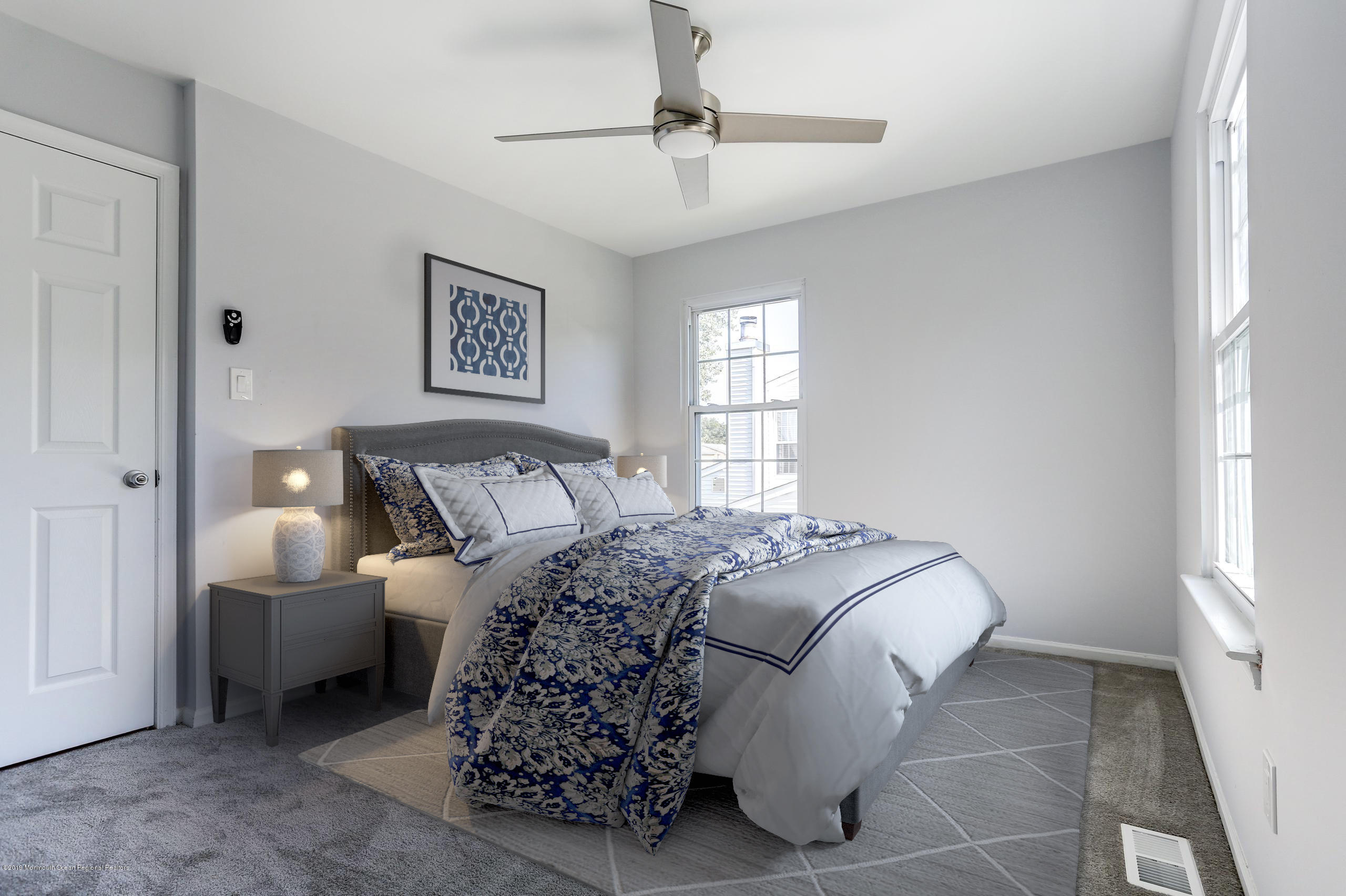 32 Hedgewood Road Howell, NJ 07731 - Photo 12 of 30 a bedroom with a bed and a chandelier