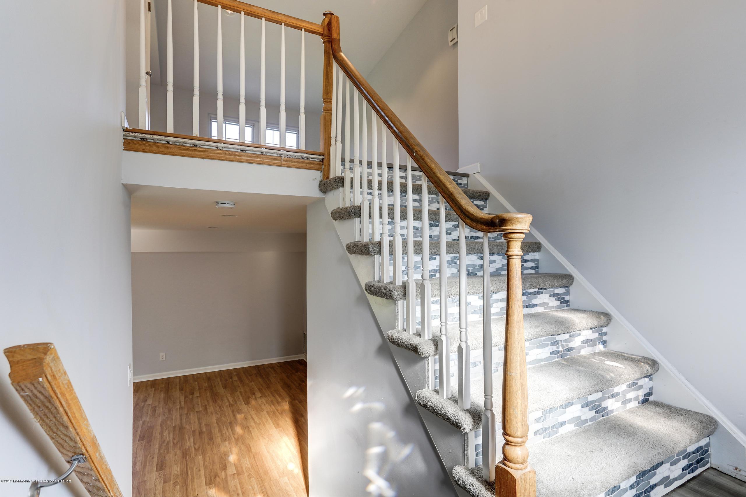 32 Hedgewood Road Howell, NJ 07731 - Photo 16 of 30 a view of staircase with wooden floor and white walls