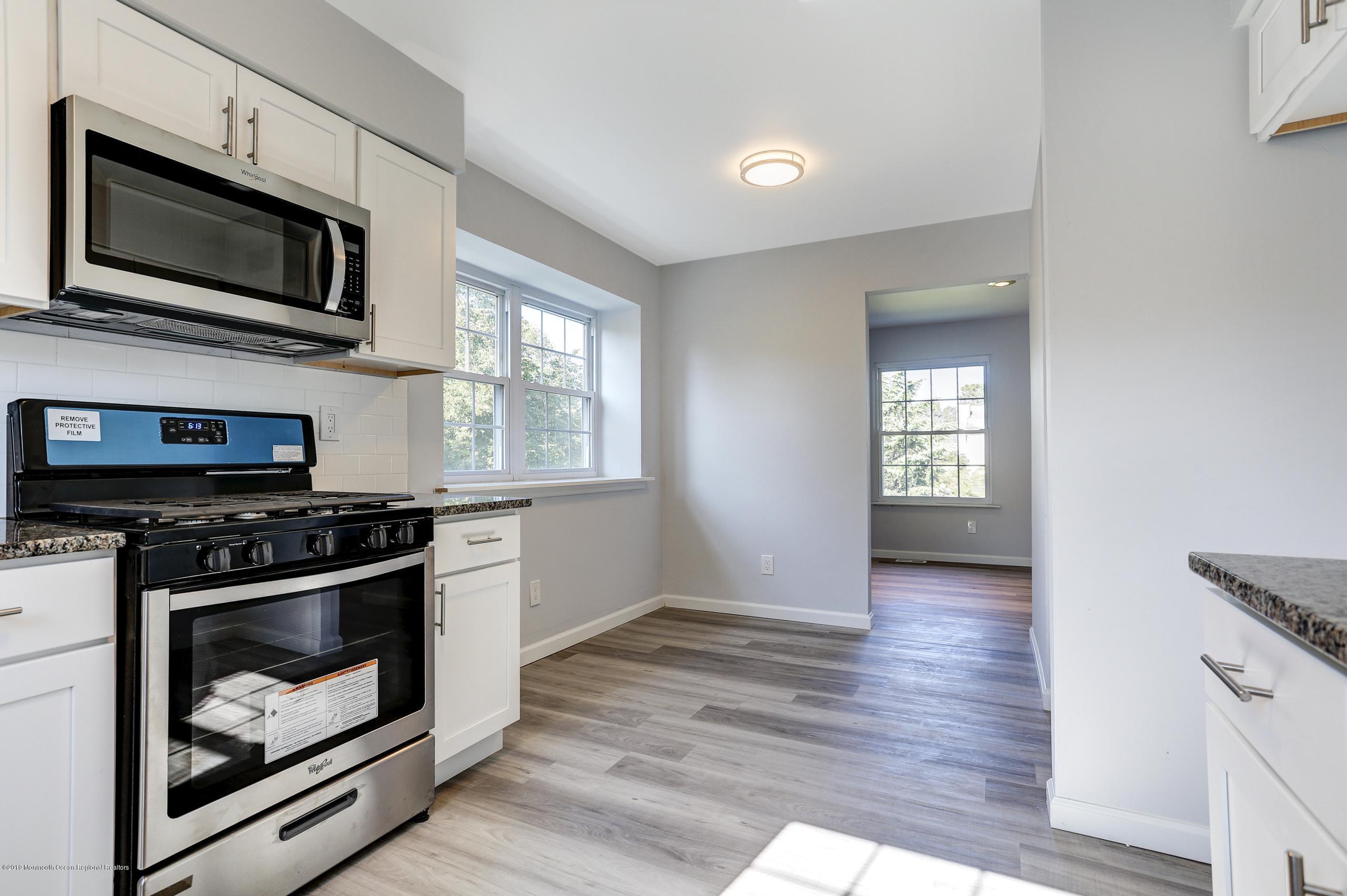 32 Hedgewood Road Howell, NJ 07731 - Photo 18 of 30 a kitchen with a stove and a microwave