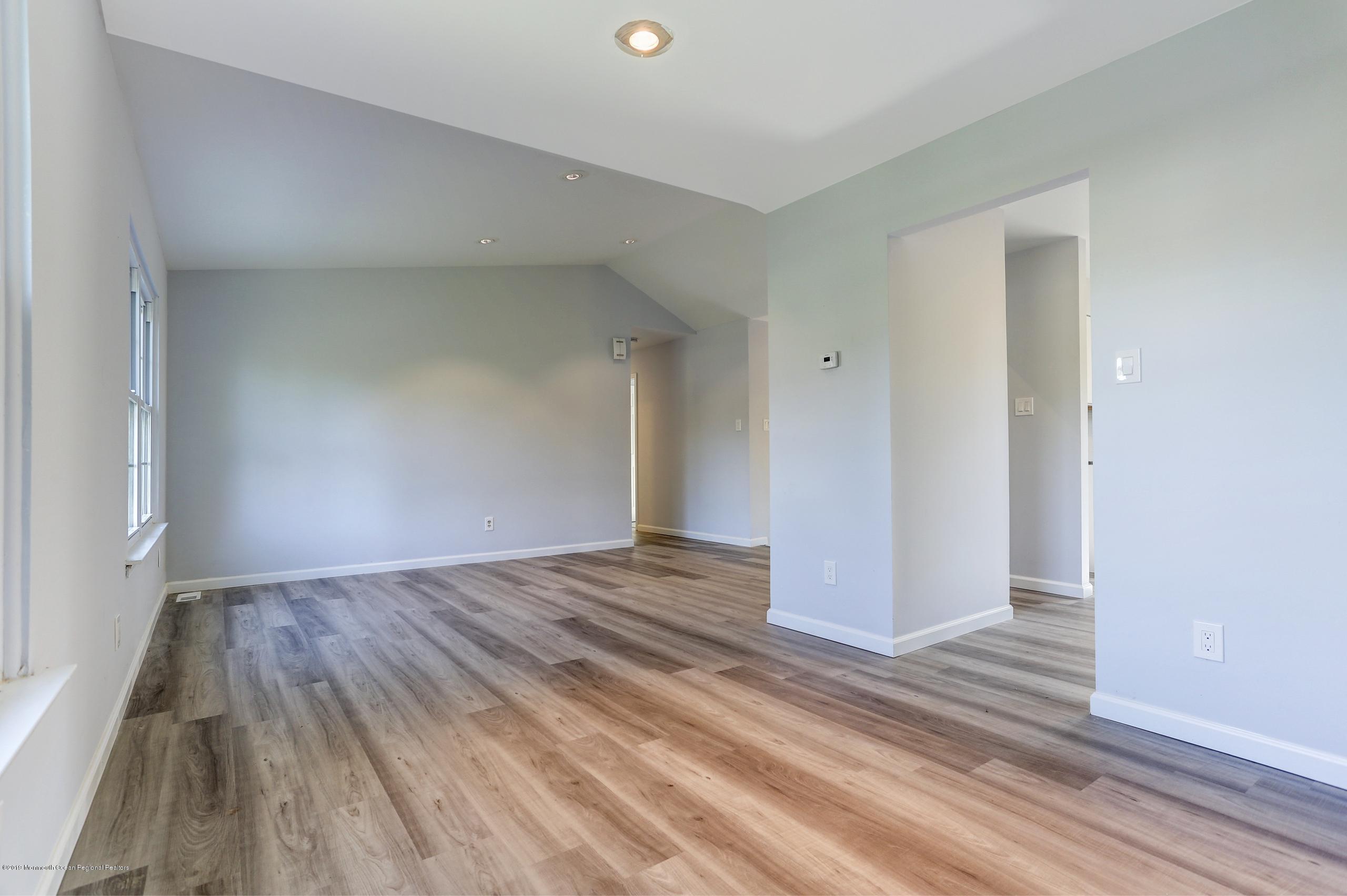 32 Hedgewood Road Howell, NJ 07731 - Photo 3 of 30 a view of empty room with wooden floor