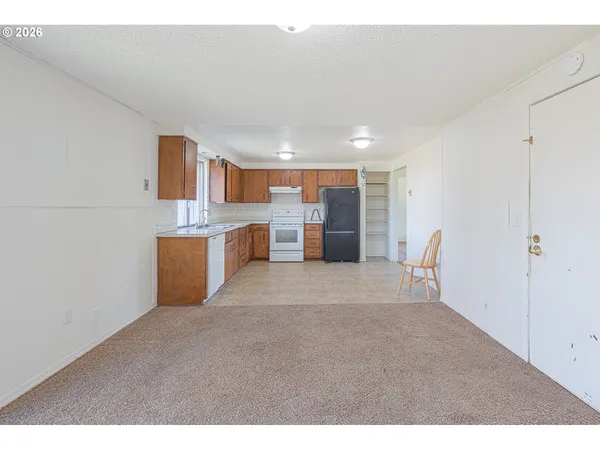 a view of kitchen with furniture and large window