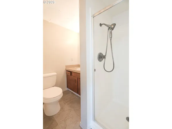 a bathroom with a sink toilet vanity and tub