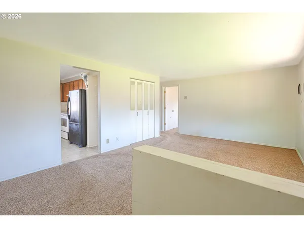 a room with a window and a ceiling fan