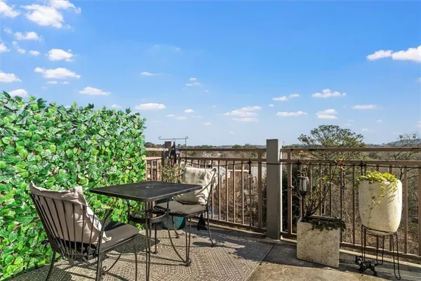a view of a chairs and table in the patio