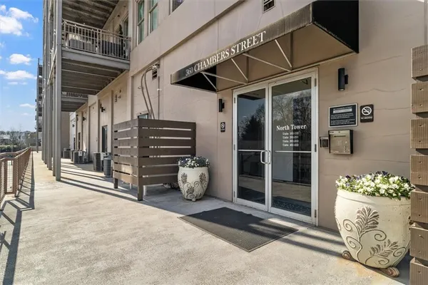 a view of an entryway with a flower pot