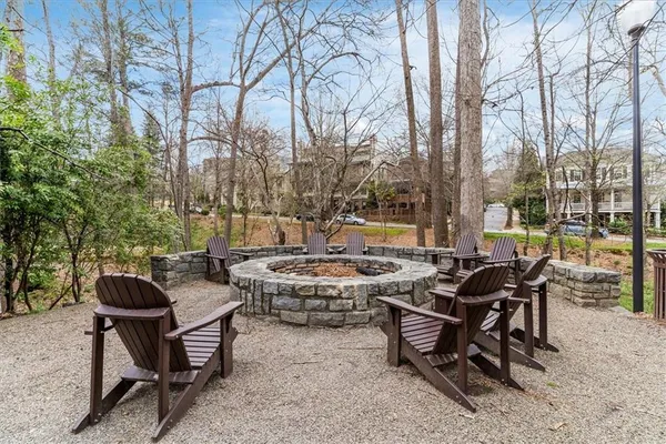 a view of a patio with table and chairs and potted plants
