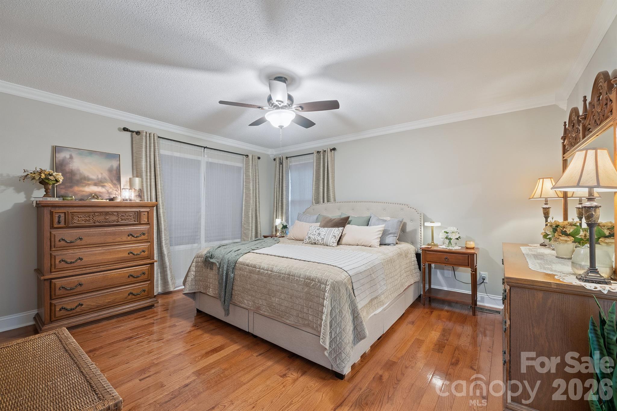 19017 Kailua Circle Tega Cay, SC 29708 - Photo 22 of 46 a bedroom with a bed and a chandelier