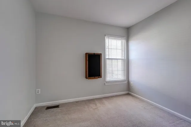 a bathroom with a sink toilet vanity and shower