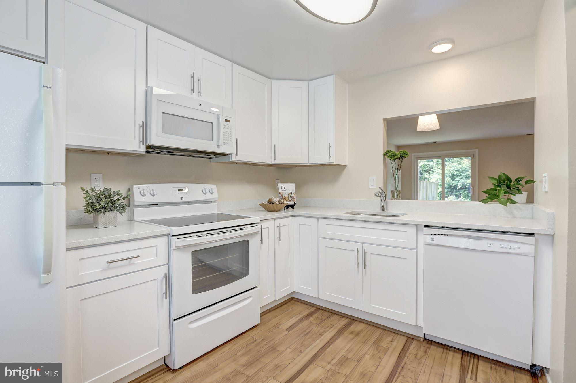 10716 Lester Street Silver Spring, MD 20902 - Photo 6 of 25 Brand new cabinets and white quartz counter tops!
