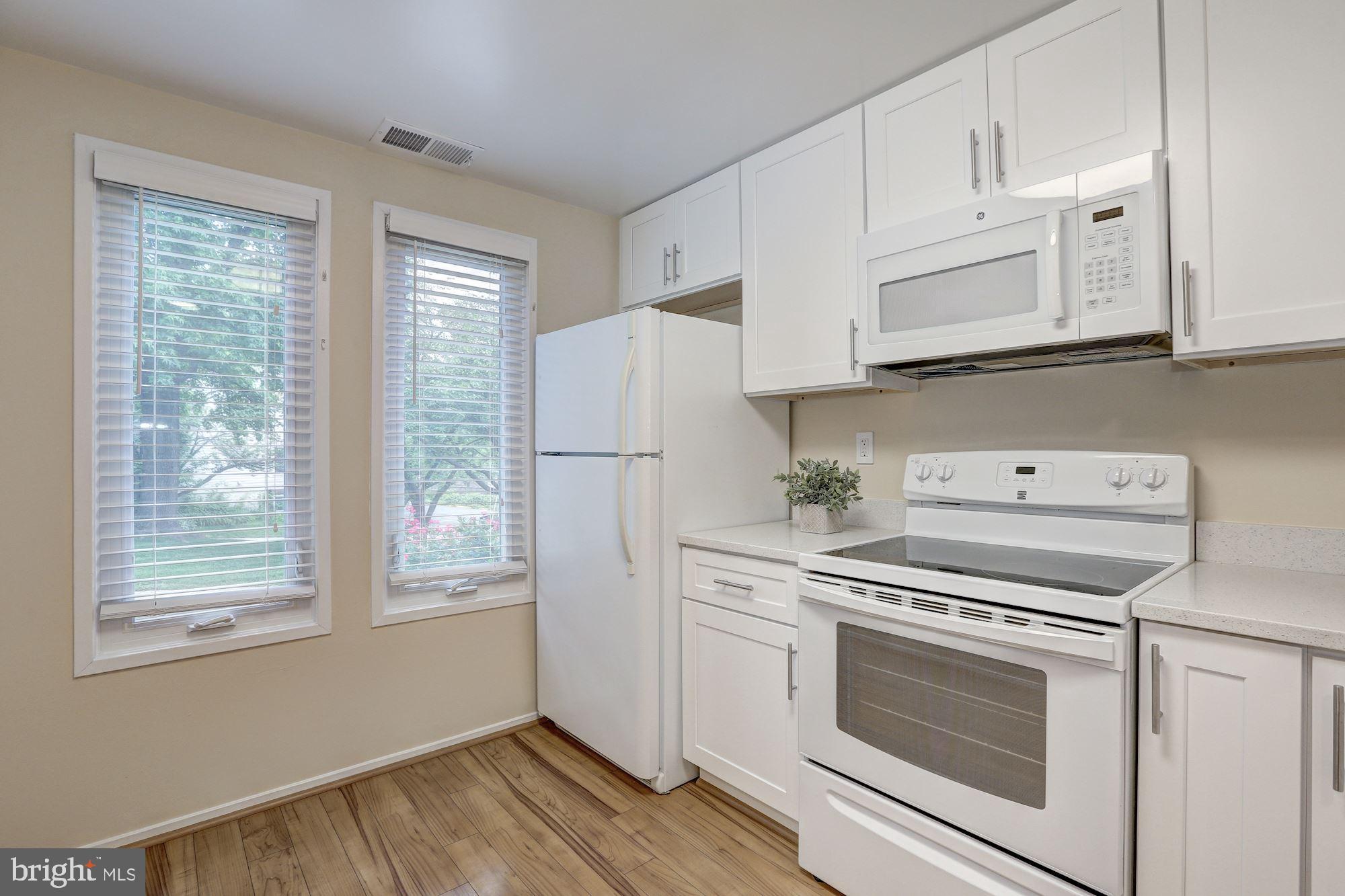 10716 Lester Street Silver Spring, MD 20902 - Photo 8 of 25 Brand new GE microwave and newer stove and fridge.