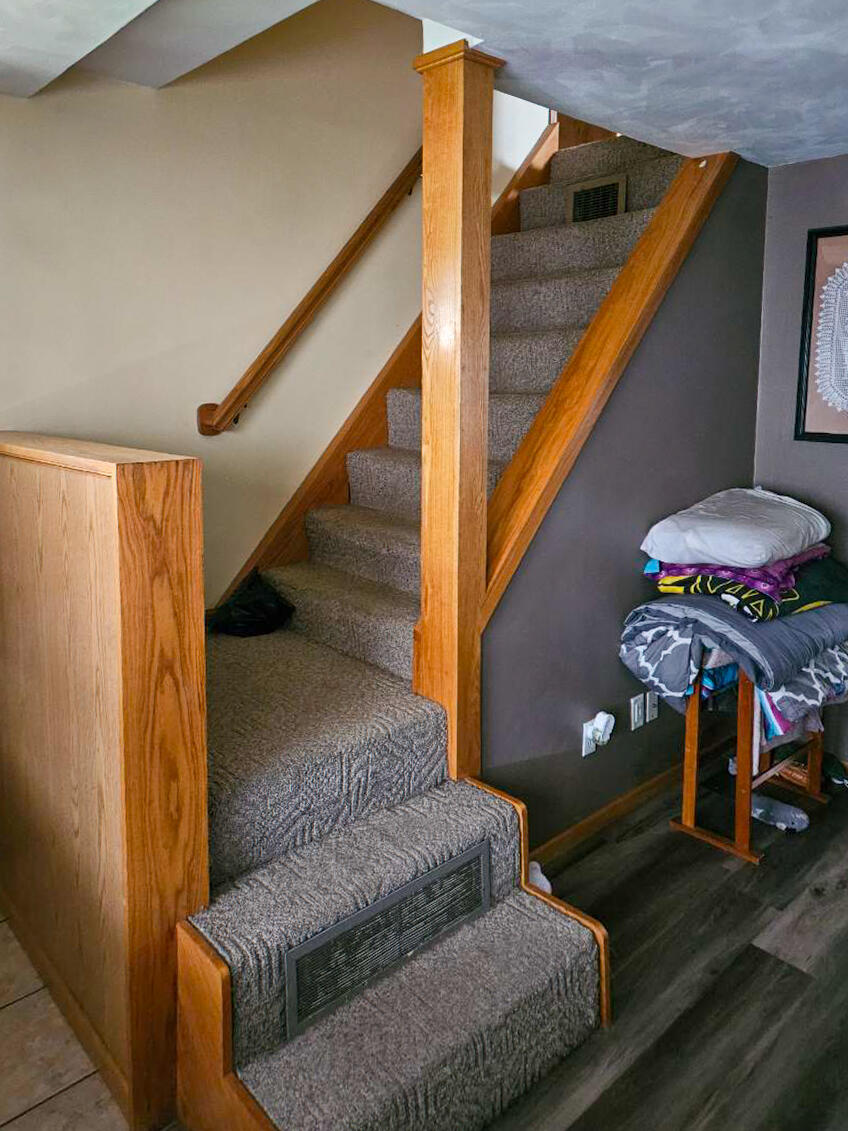 514 East Iowa Street Prairie du Chien, WI 53821 - Photo 8 of 18 Living room stairs