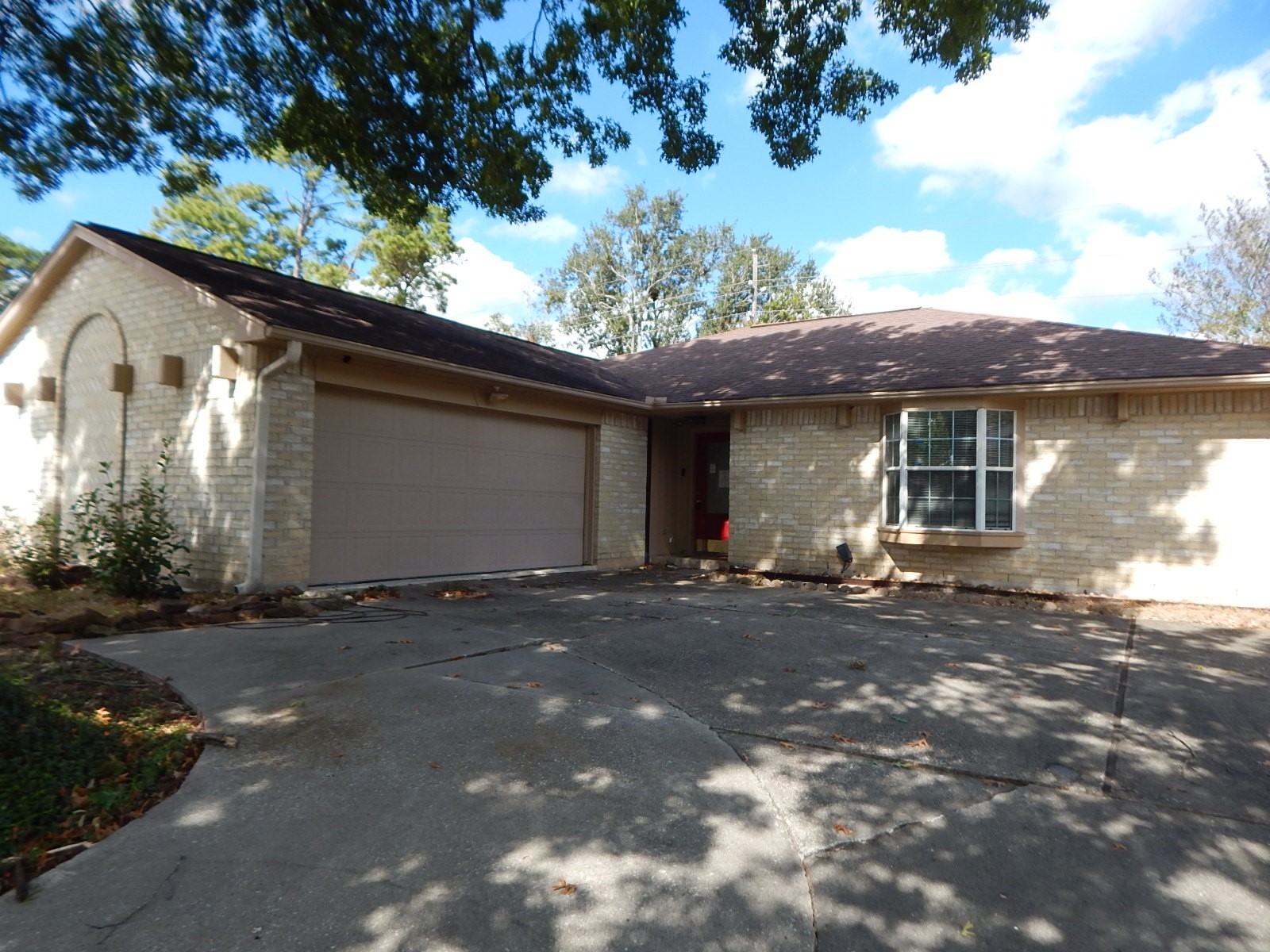 4706 Owens Creek Lane Spring, TX 77388 - Photo 4 of 12 a front view of a house with a yard and garage