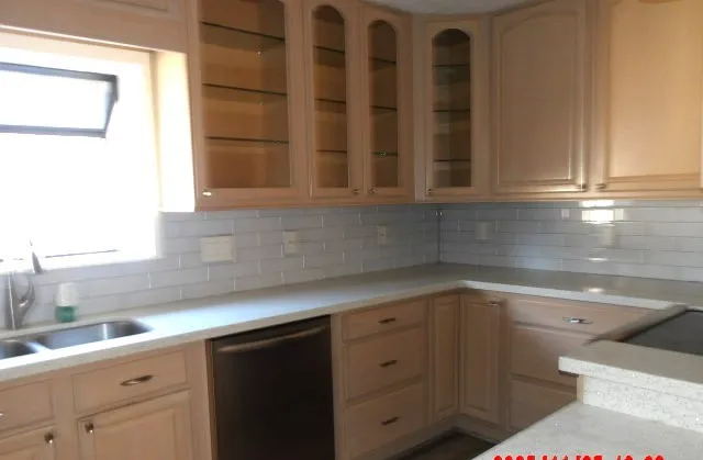 a kitchen with a sink and cabinets