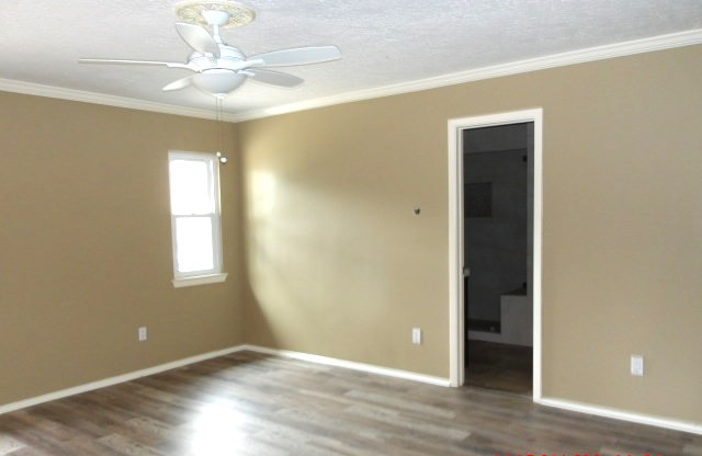 4706 Owens Creek Lane Spring, TX 77388 - Photo 7 of 12 an empty room with wooden floor and window