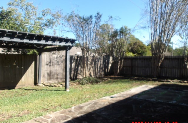 4706 Owens Creek Lane Spring, TX 77388 - Photo 10 of 12 a view of a backyard with a tree