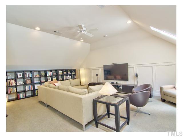 7916 Longleaf Branch Court Raleigh, NC 27612 - Photo 23 of 25 Vaulted ceiling finished 3rd floor media room, surround sound, custom panelling/trim. Game, movies, relax, extra insulation and sound barrier protection installed, won't wake anyone up while you play. Sweet!