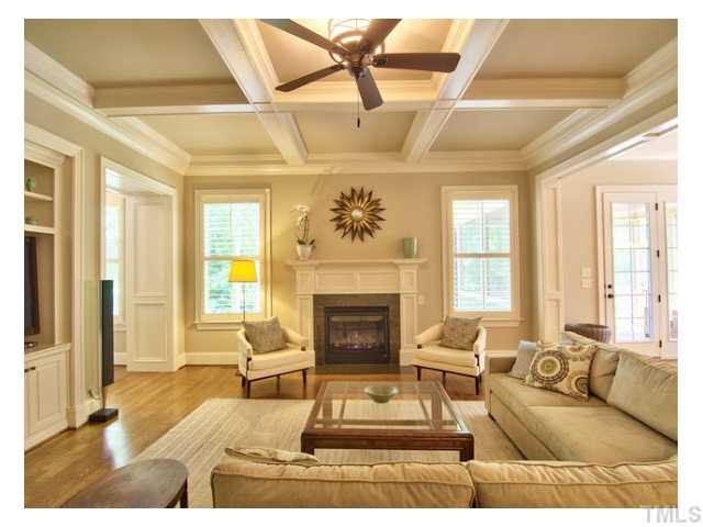 Your home sanctuary, coffered ceiling, built-in's, custom panelling, natural light, this could be your 'happy room without a roof' Triple French doors to right lead to the screen porch, your outdoor living space, a must have w/NC weather glory.