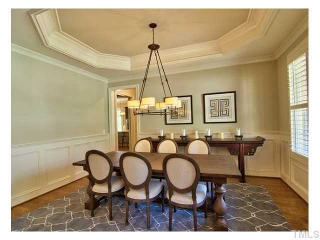Upon entry to this home, the formal dining room is to your right, how do you spell 'entertainment and welcome guests'? A sneak peak to the kitchen area you may glimpse through the doorway on the left in this picture/angle.