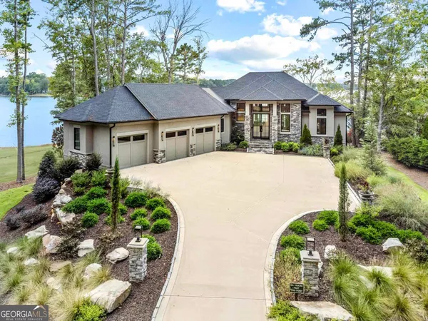 a front view of a house with a garden