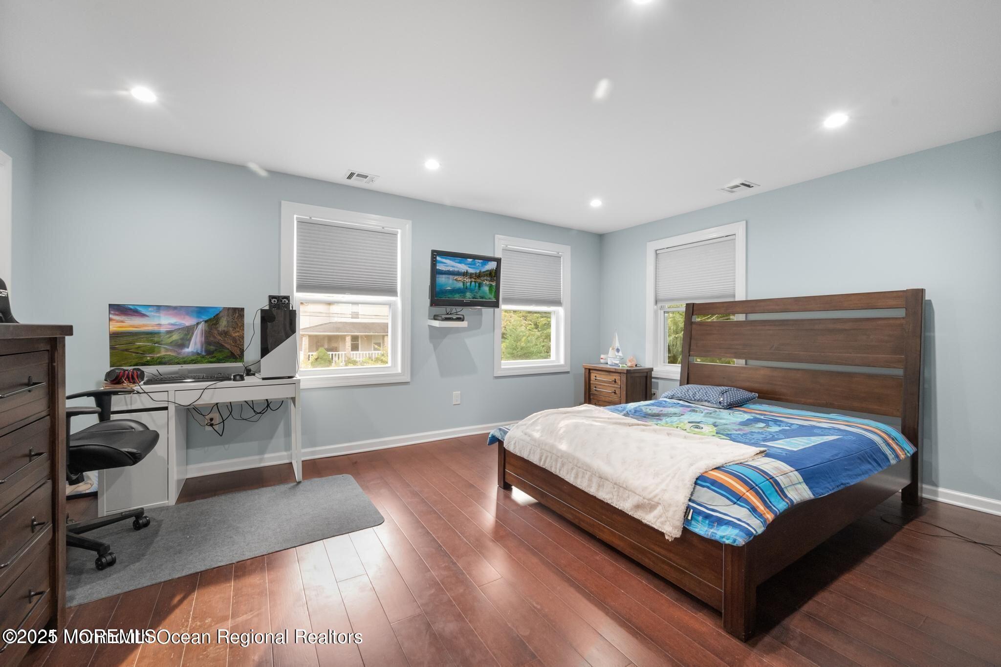 300 Monmouth Road West Long Branch, NJ 07764 - Photo 5 of 10 a bedroom with a bed and a desk