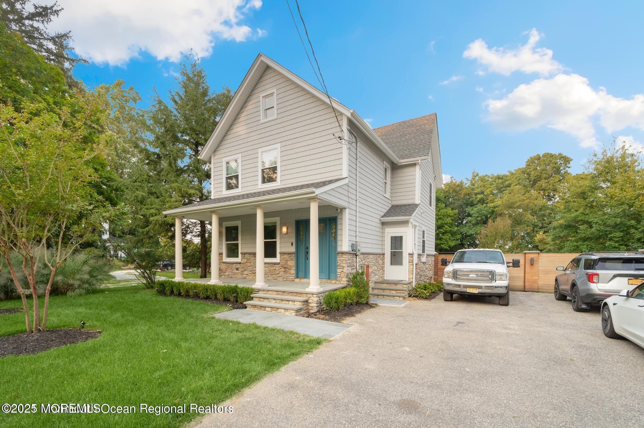 300 Monmouth Road West Long Branch, NJ 07764 - Photo 10 of 10 a front view of a house with a garden