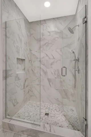 an empty room with windows and entrance